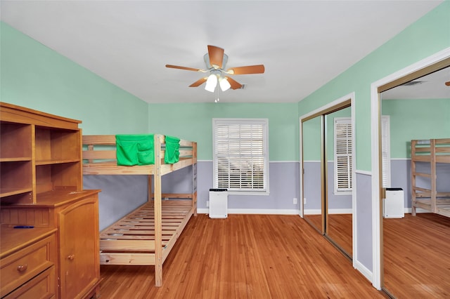 unfurnished bedroom featuring ceiling fan, a closet, and light hardwood / wood-style floors