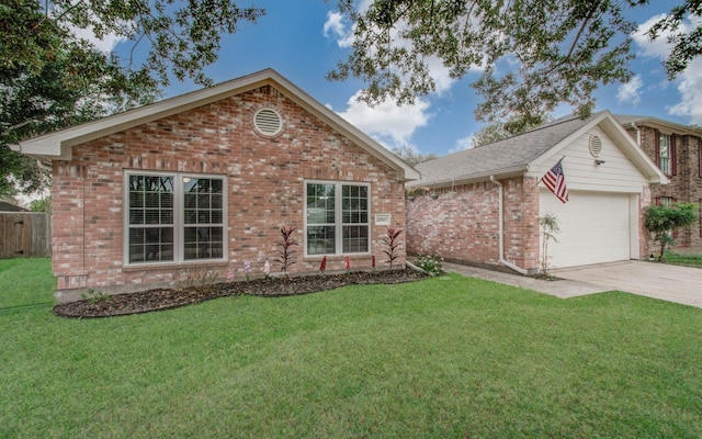 view of front of property featuring a front lawn and a garage