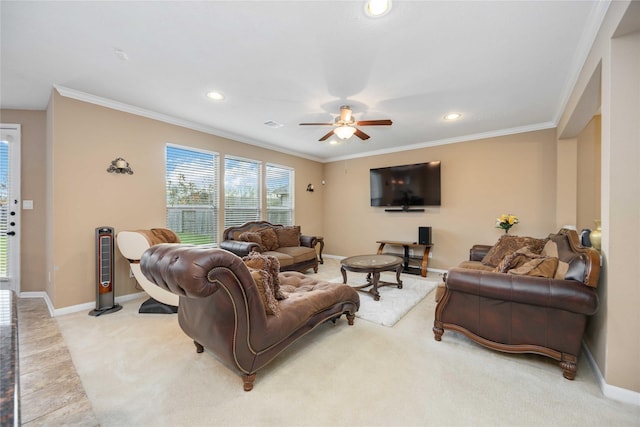 living room with ceiling fan, crown molding, and light carpet