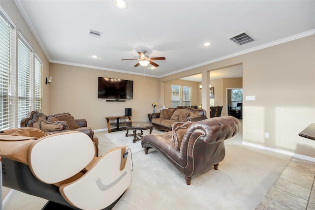 tiled living room featuring ceiling fan and ornamental molding