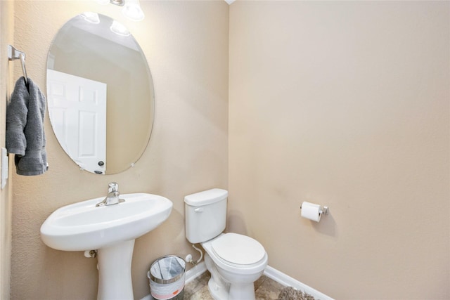 bathroom featuring toilet