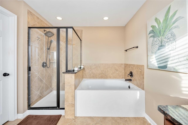 bathroom with tile patterned flooring and independent shower and bath