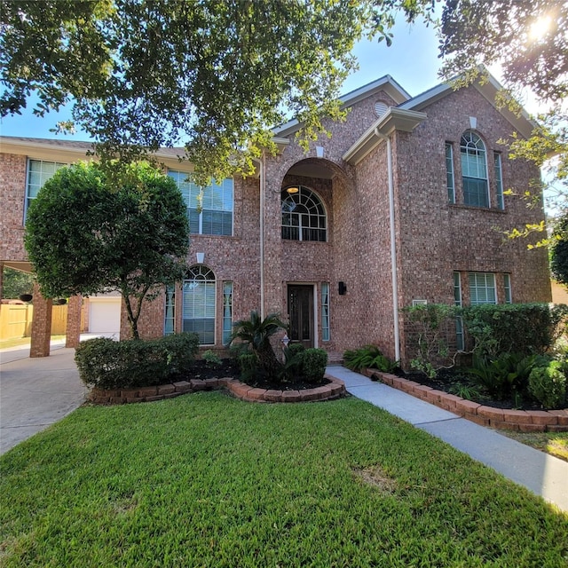 view of front facade featuring a garage and a front lawn