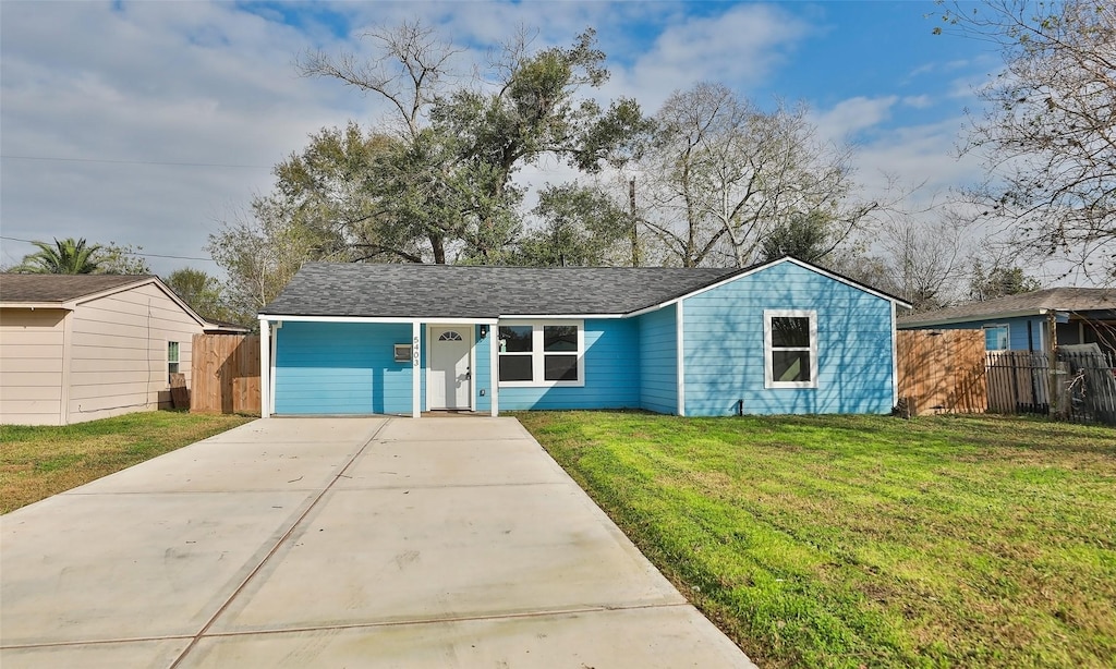 ranch-style home with a front lawn