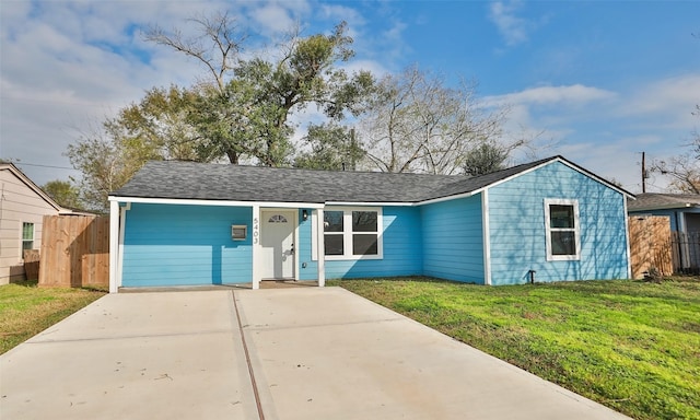 single story home featuring a garage and a front lawn