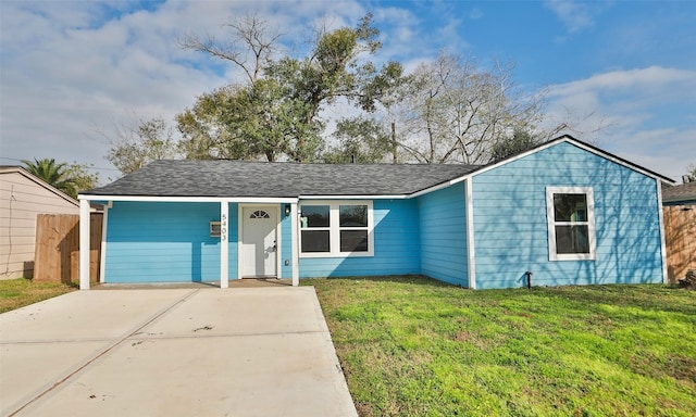 ranch-style home with a front lawn