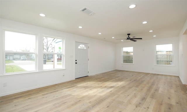 foyer featuring ceiling fan and light wood-type flooring