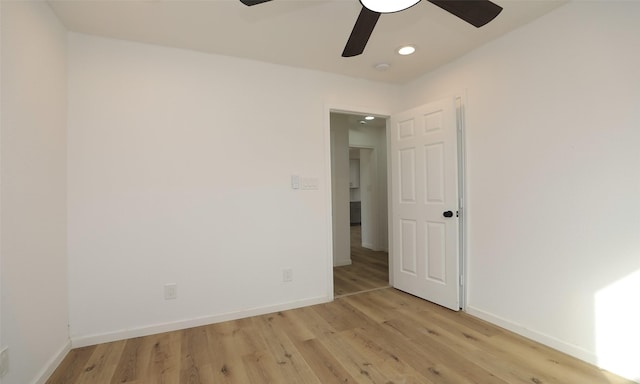 unfurnished room featuring ceiling fan and light hardwood / wood-style floors