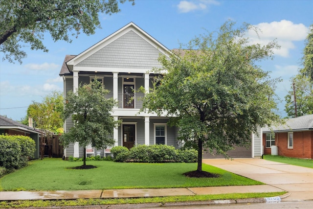 view of front facade with a front yard and a garage