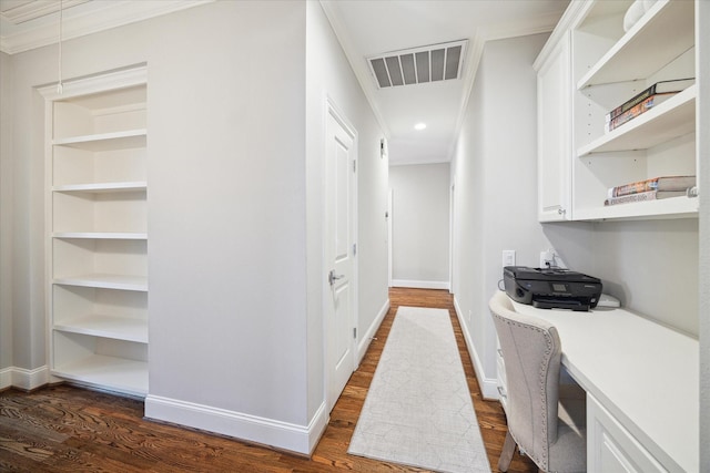 interior space featuring crown molding and dark wood-type flooring