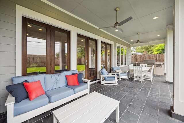 view of patio with area for grilling, an outdoor hangout area, and french doors