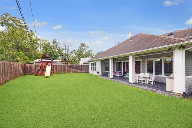 view of yard with a playground and a patio area