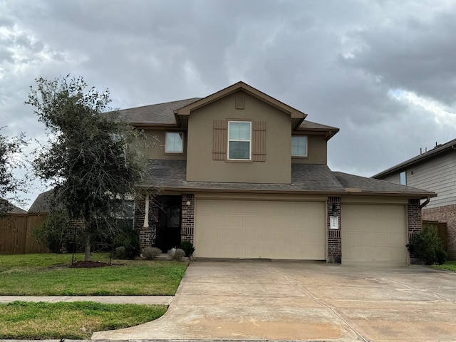 view of front of house with a garage and a front yard