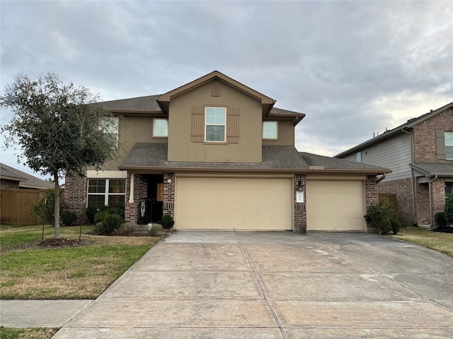 view of front of home with a garage and a front yard