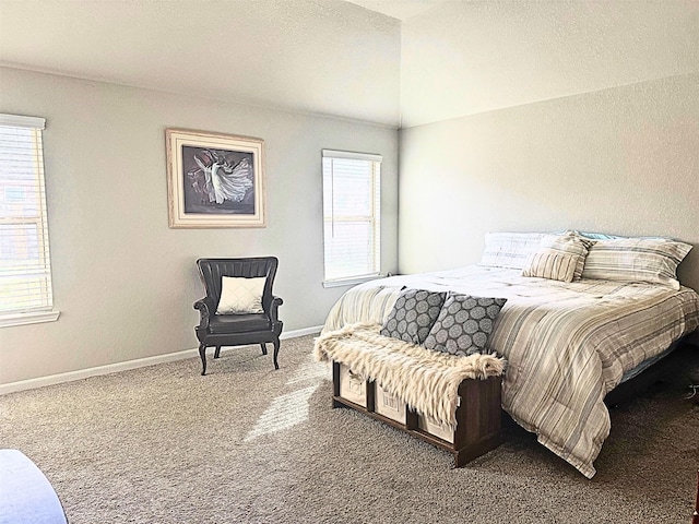 carpeted bedroom with multiple windows and baseboards