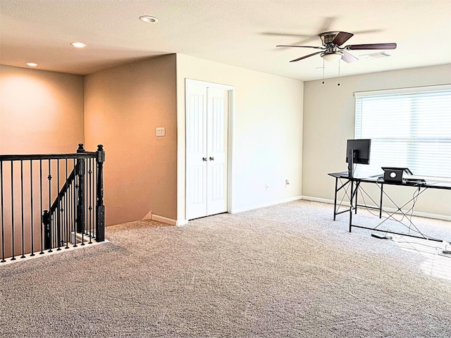 unfurnished office featuring carpet, visible vents, baseboards, and recessed lighting