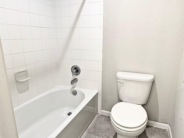 full bath with baseboards, shower / bathing tub combination, and toilet