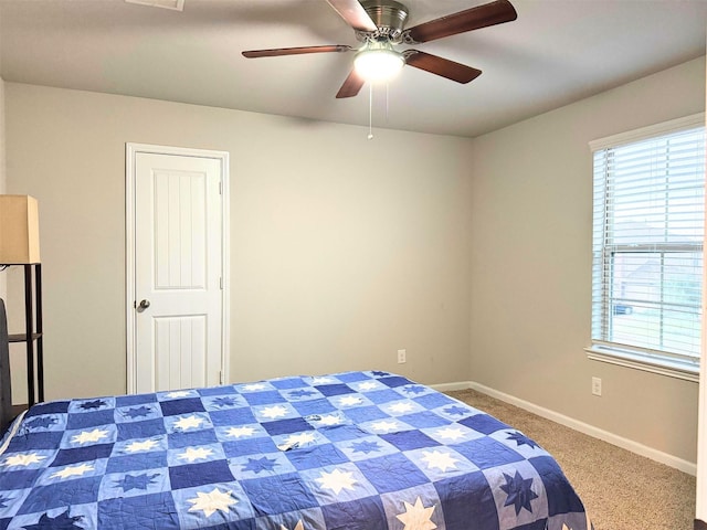 bedroom with carpet flooring, ceiling fan, and baseboards