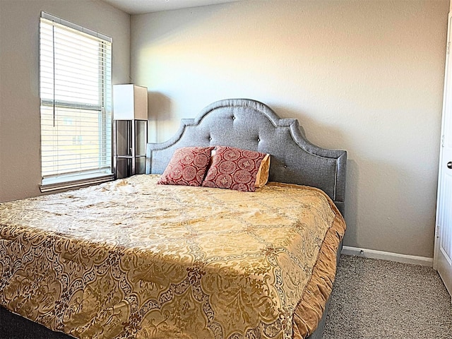 carpeted bedroom with baseboards