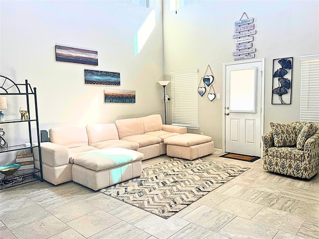 living room with a high ceiling