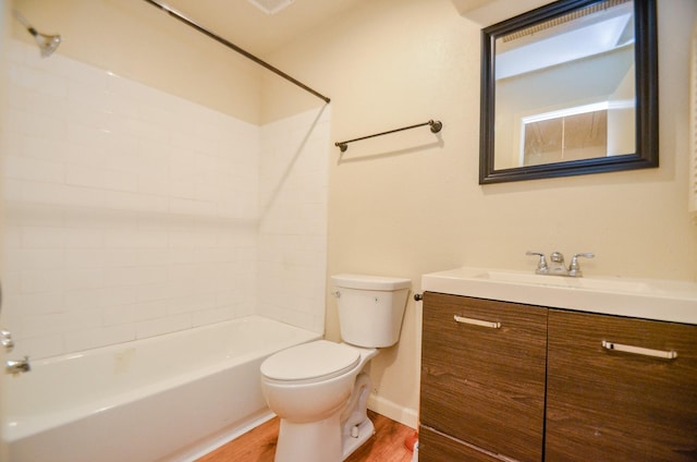 full bathroom with hardwood / wood-style floors, vanity, toilet, and tub / shower combination