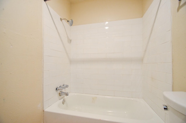 bathroom with toilet and bathtub / shower combination