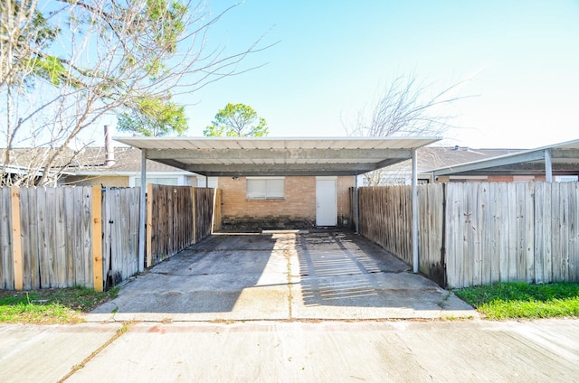 view of parking / parking lot featuring a carport