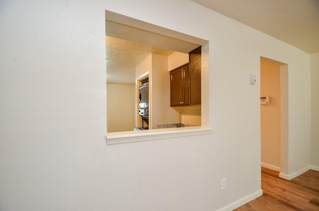 interior space featuring light hardwood / wood-style floors and a textured ceiling