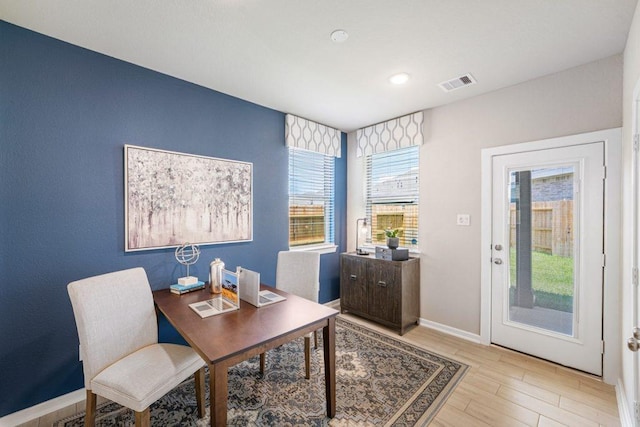 office featuring plenty of natural light and light hardwood / wood-style flooring