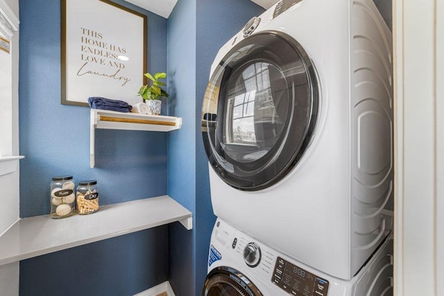 laundry area with stacked washer / dryer