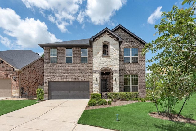 view of front of property featuring a front yard and a garage