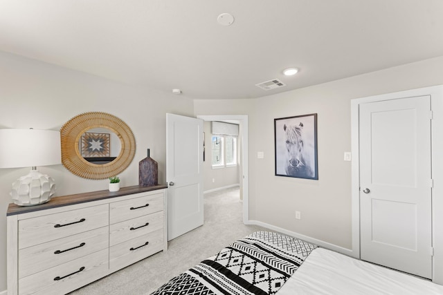 bedroom featuring light colored carpet