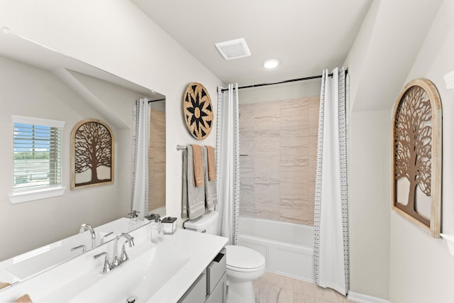 full bathroom featuring shower / tub combo, vanity, toilet, and vaulted ceiling