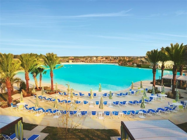 view of swimming pool featuring a water view