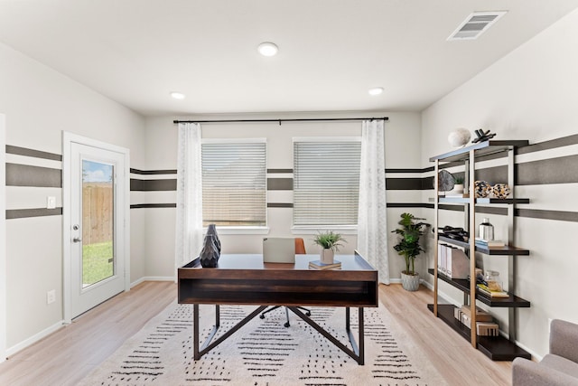 office area with light hardwood / wood-style floors