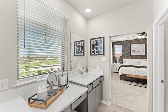 bathroom with ceiling fan and vanity