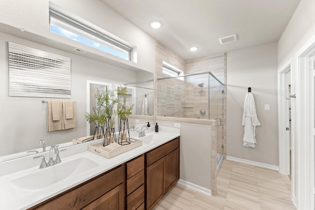 bathroom with vanity and an enclosed shower