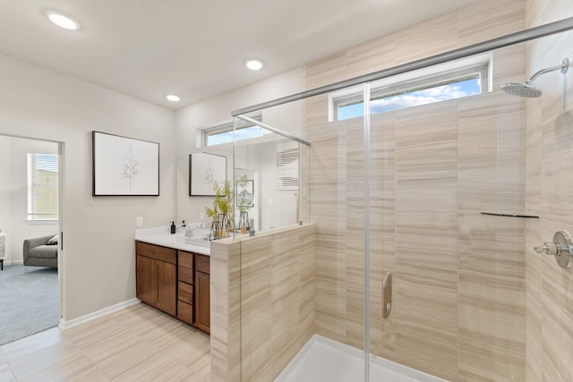 bathroom with vanity and walk in shower