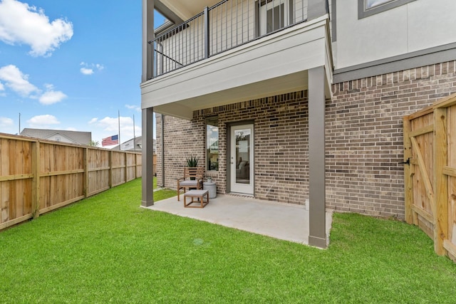 exterior space featuring a patio and a lawn