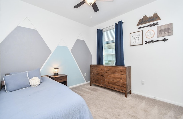 bedroom featuring ceiling fan, light colored carpet, and vaulted ceiling