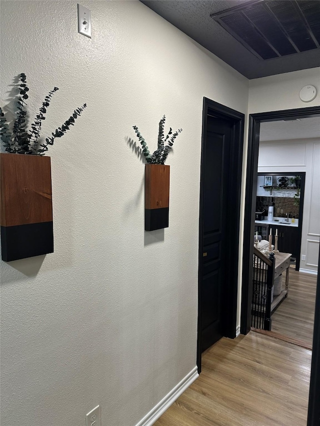 hallway featuring hardwood / wood-style floors