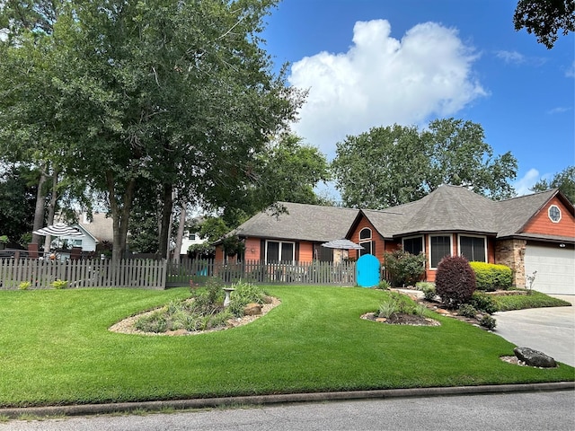 ranch-style home featuring a front lawn and a garage