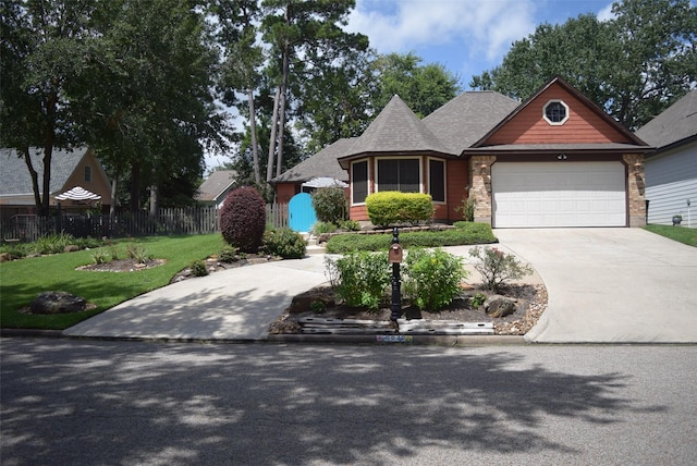 view of front facade featuring a front lawn and a garage