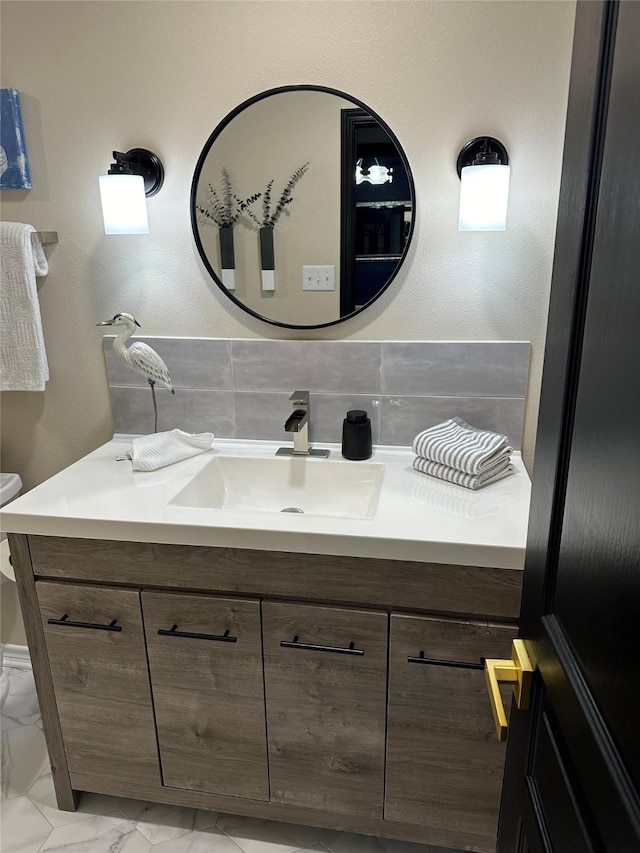 bathroom with backsplash and vanity