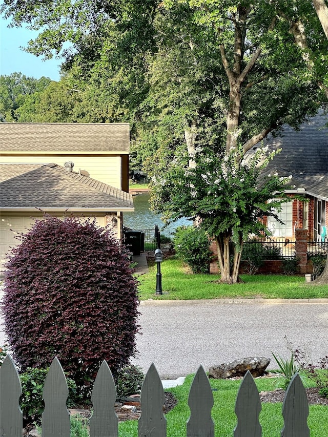 view of side of home featuring a water view