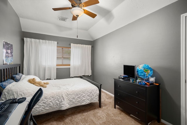 bedroom featuring ceiling fan, light carpet, and vaulted ceiling