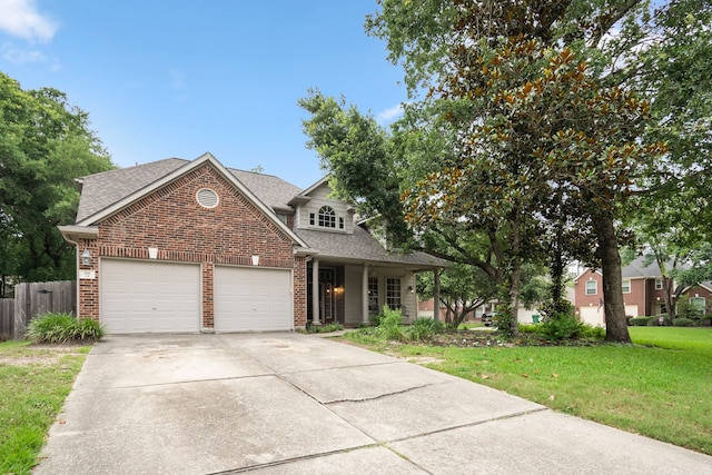 view of front of property featuring a garage and a front yard