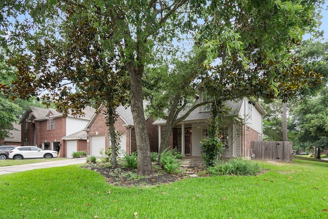 view of front of home with covered porch and a front lawn