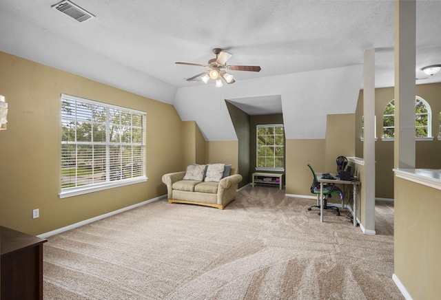 sitting room featuring ceiling fan, carpet floors, and vaulted ceiling