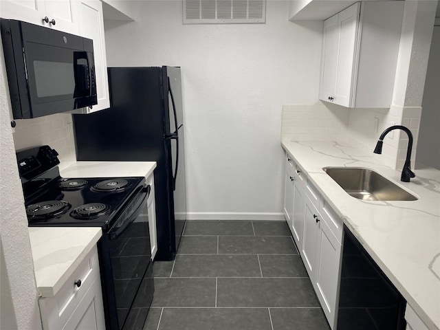 kitchen with backsplash, sink, white cabinets, and black appliances